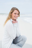 Portrait of a smiling casual woman relaxing at beach