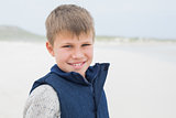 Close-up of a cute smiling boy at beach