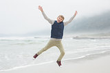 Full length of a boy jumping at beach