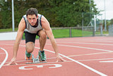 Young man ready to race on running track