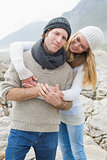 Happy romantic couple together on rocky landscape