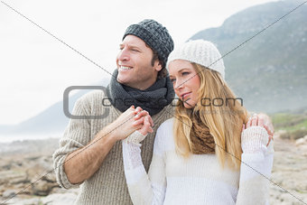 Romantic couple together on rocky landscape