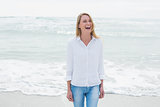 Casual woman laughing at beach