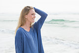 Side view of a smiling casual woman at beach