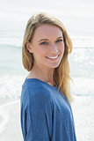 Portrait of a smiling casual woman at beach