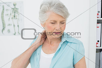 Senior woman suffering from neck pain