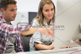 Classmates working together in the computer room