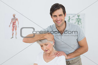 Senior woman getting the neck adjustment done