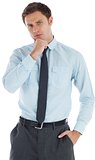 Thoughtful businessman with hand on chin