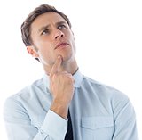 Thinking businessman with finger on chin