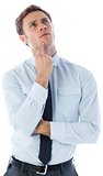 Thinking businessman with finger on chin