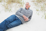 Casual senior man relaxing at beach