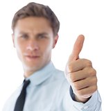 Businessman showing thumbs up