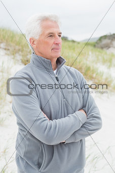 Contemplative senior man at beach