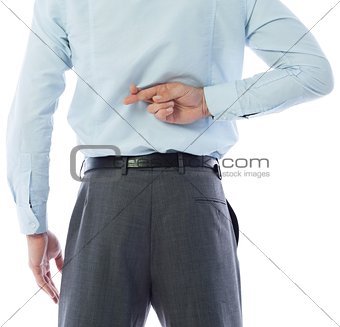 Businessman crossing fingers behind his back