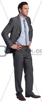 Smiling businessman with hands on hips