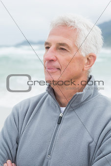 Senior man looking away at beach