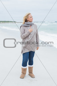 Contemplative casual senior woman at beach