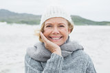Smiling casual senior woman at beach