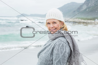 Smiling casual senior woman at beach