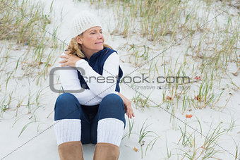 Senior woman with eyes closed at beach