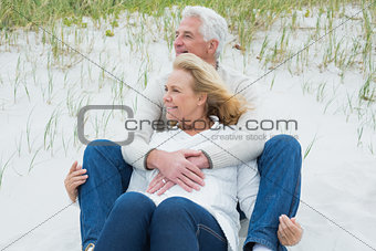 Romantic senior couple relaxing at beach
