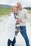Portrait of a happy senior couple at beach