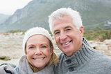 Senior couple together on rocky landscape