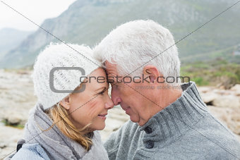 Close-up side view of a romantic senior couple together