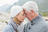 Close-up side view of a romantic senior couple