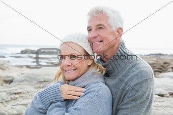 Romantic senior couple together on beach