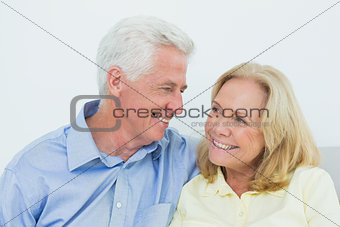 Happy romantic senior couple at house