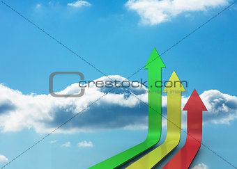 Colourful arrows pointing up against sky