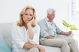 Displeased relaxed senior couple at home