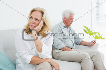 Displeased relaxed senior couple at home