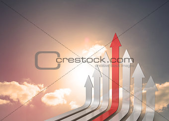 Red and grey arrows pointing up against sky