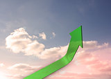 Green curved arrow pointing up against sky