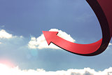 Red curved arrow pointing up against sky