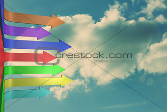 Colorful arrows pointing against sky