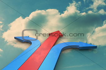 Blue and red arrows pointing against sky