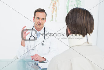 Doctor in communication with patient at medical office