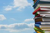 Pile of books against sky