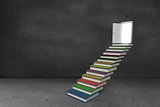 Steps made from books leading to door in grey room