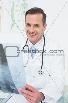 Portrait of a smiling male doctor with x-ray