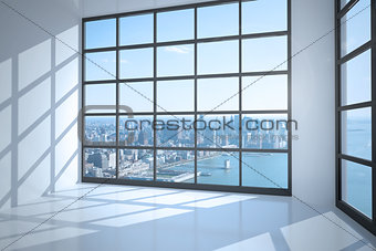Room with large window showing city