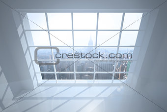 Room with large window showing city