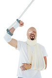 Cheerful man with broken hand and crutch cheering