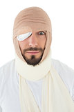 Close-up portrait of a man with head tied up in bandage