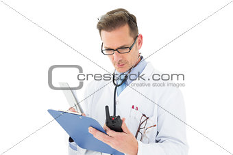 Serious doctor reading reports