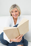 Portrait of a relaxed woman reading book